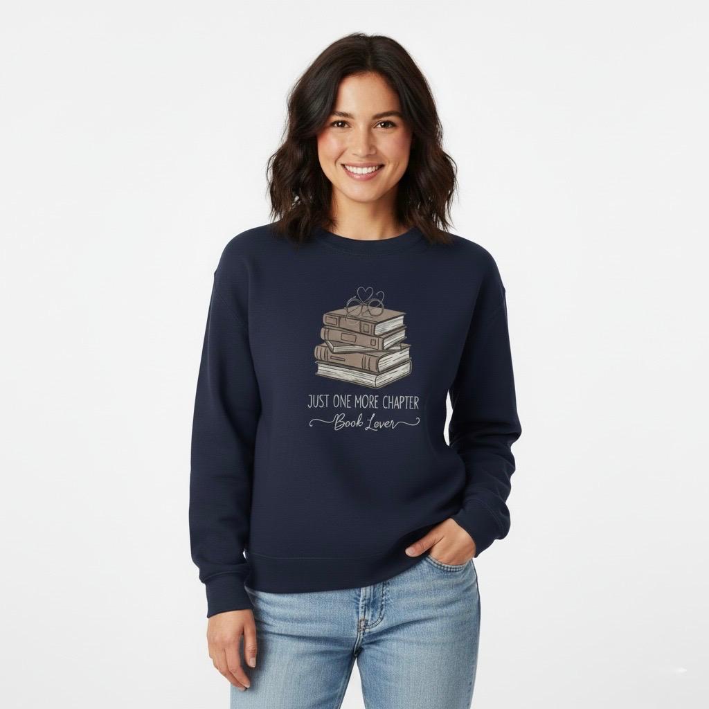 Woman wearing a Navy blue sweatshirt with book design and text on a white background