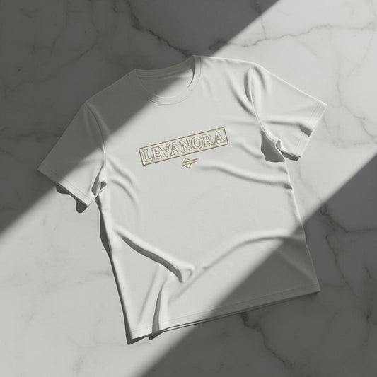 White t-shirt with 'LEVANORA' logo on a marble surface