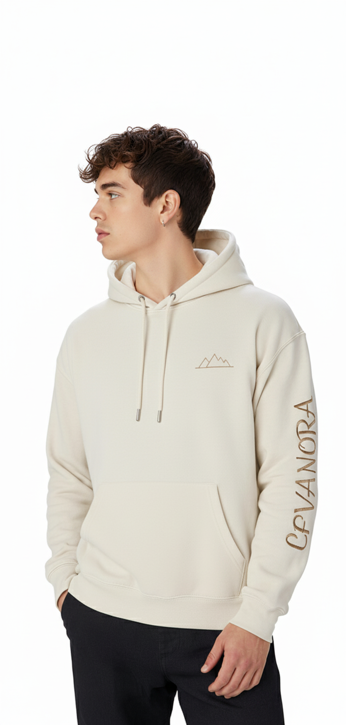 Man wearing a Sand beige hoodie with a logo on the chest and text on the sleeve against a white background