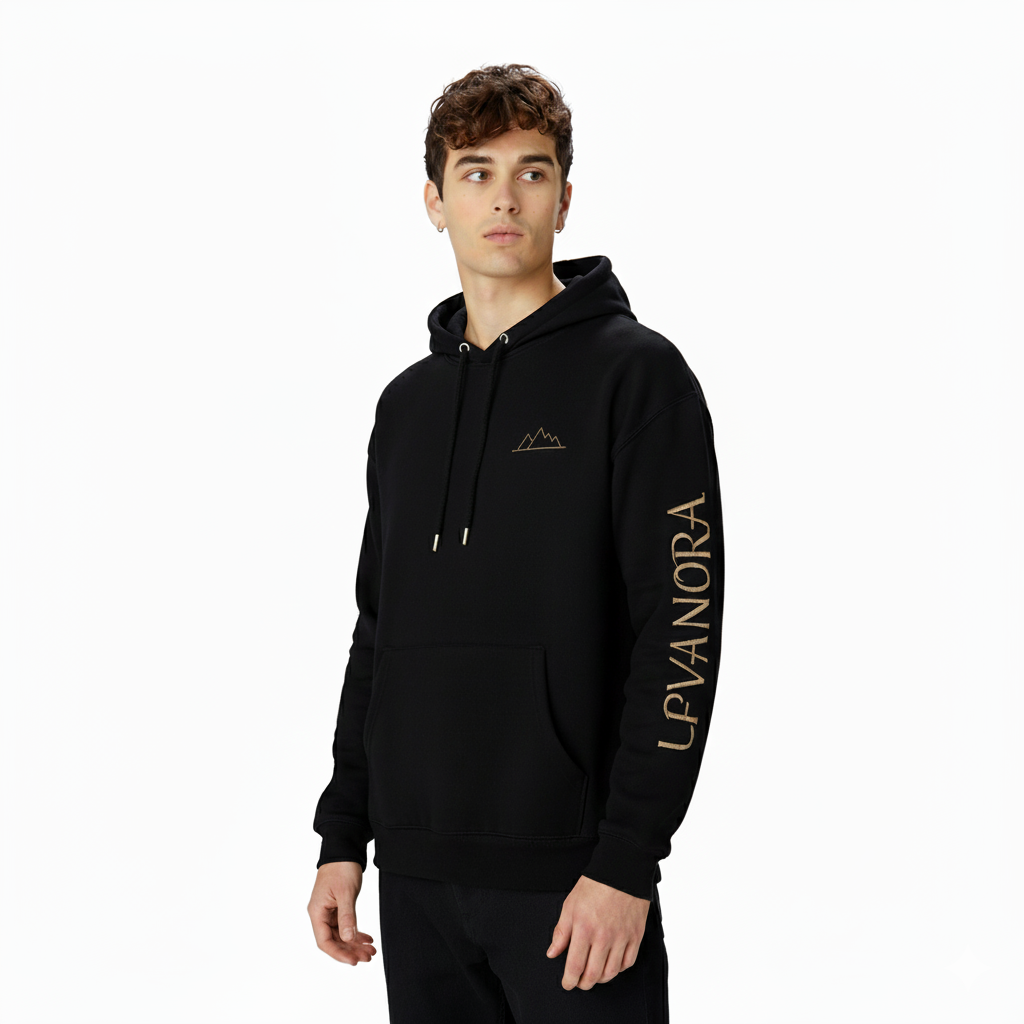 Person wearing a Black hoodie with gold text on a white background