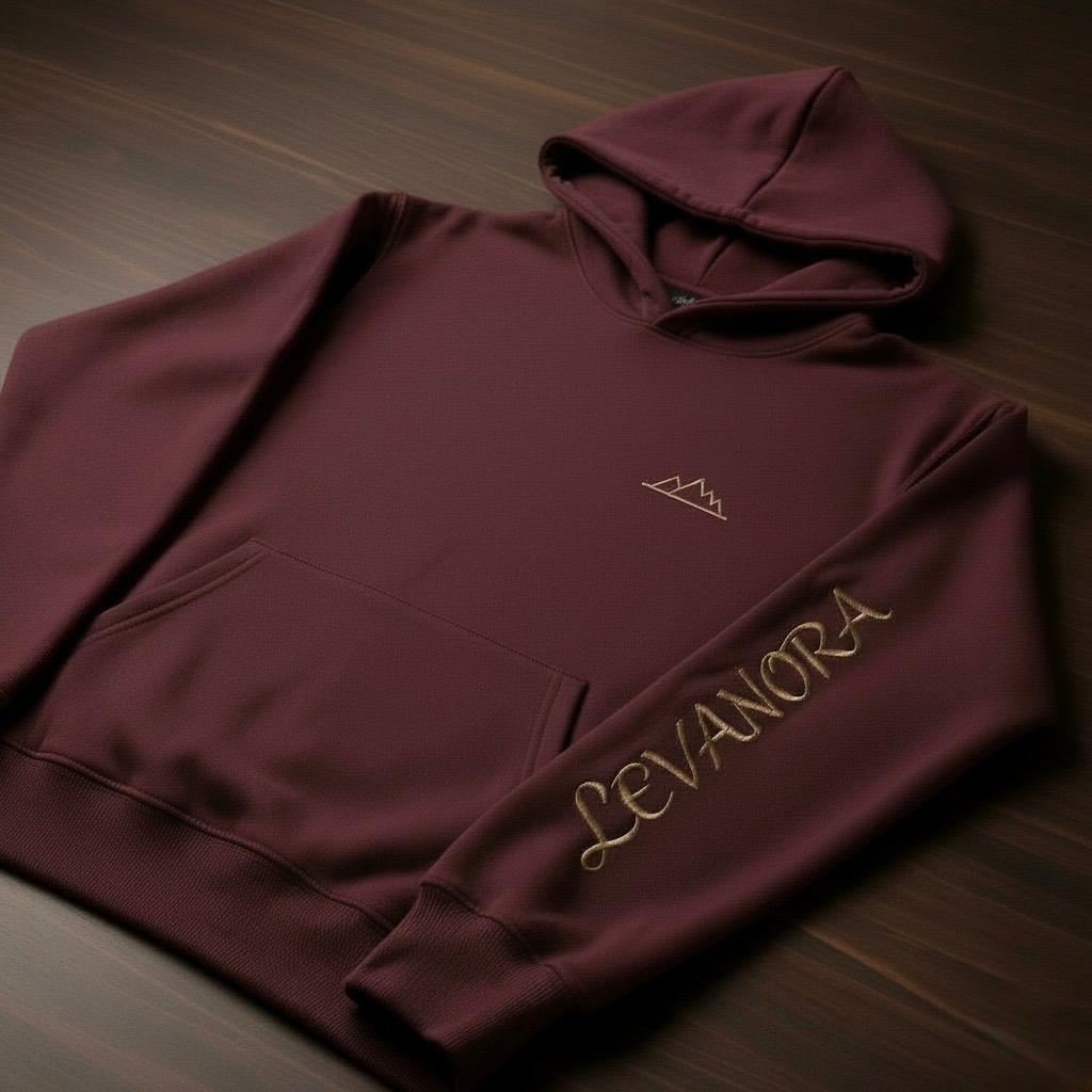 Maroon hoodie with 'Levanora' branding on a wooden surface